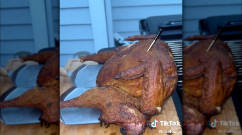 turkey coming out of a grill