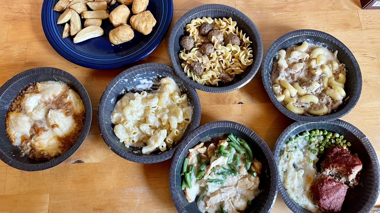 A selection of cooked microwave meals on table