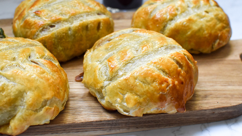 beef wellington on cutting board 