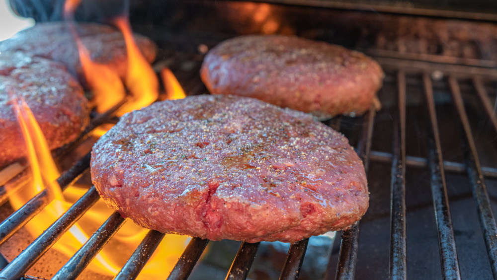 grilling burgers for Gordon Ramsay's burger recipe with a twist