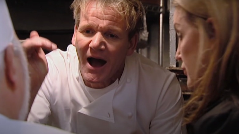 Gordon Ramsay yells and raises his hand