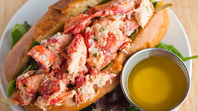 Lobster Roll on plate with butter sauce