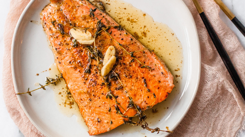 cooked salmon with herbs and lemon butter