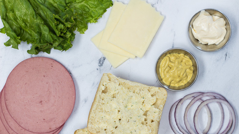 Bologna sandwich ingredients on counter