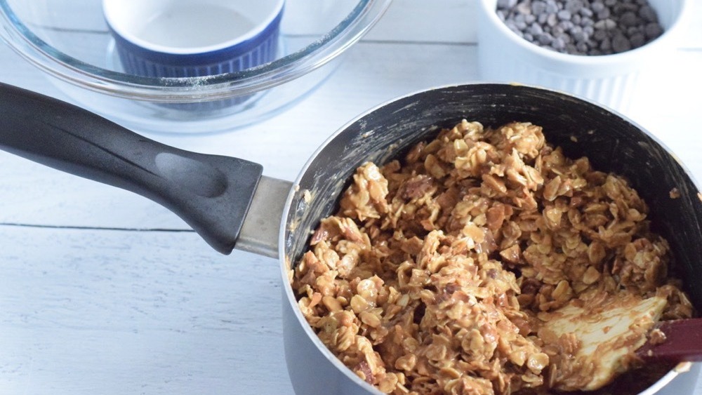 oats added to peanut butter mixture in pan