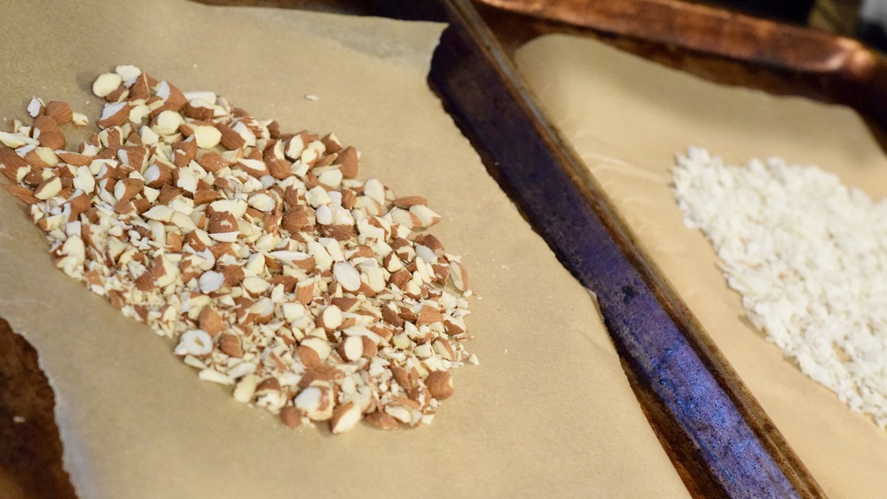 almonds and coconut on baking sheets