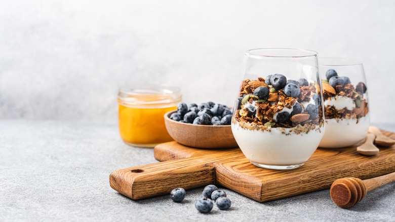 A parfait with granola and blueberries