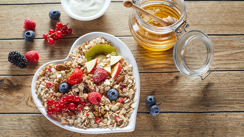 A heart-shaped bowl of muesli