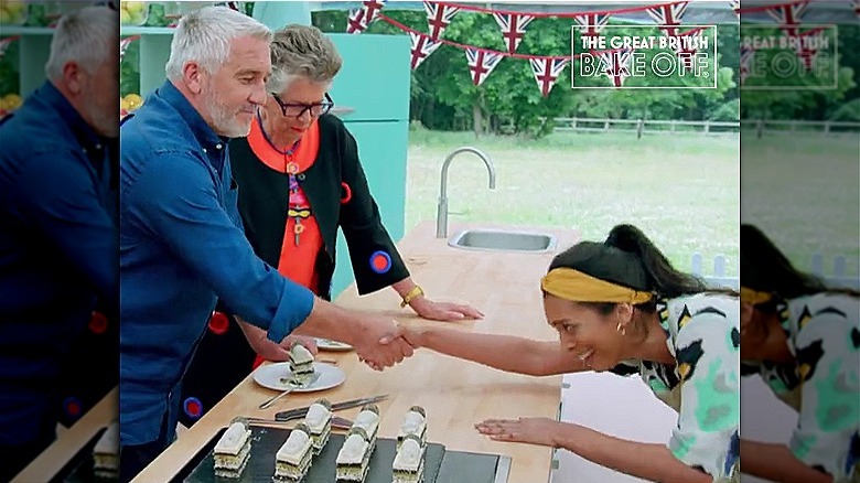 Paul Hollywood shaking Crystelle Pereira's hand