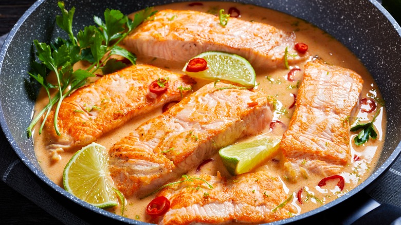 Poached salmon in oil and spices 