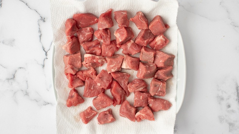 raw beef chunks on paper towel