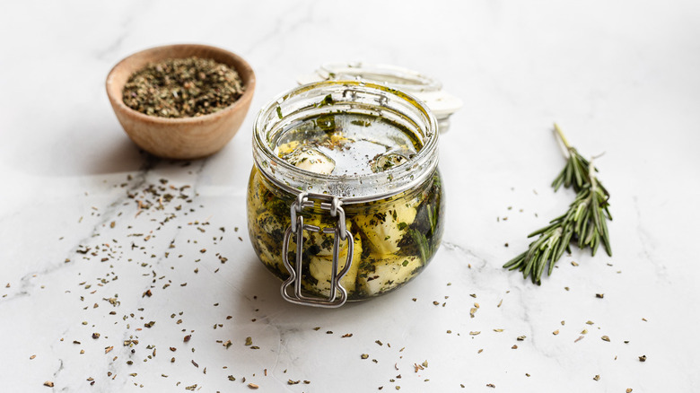 cheese curds marinating in jar