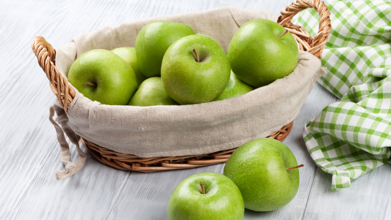 basket of green apples