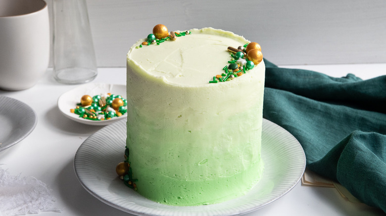 green ombre cake on plate 