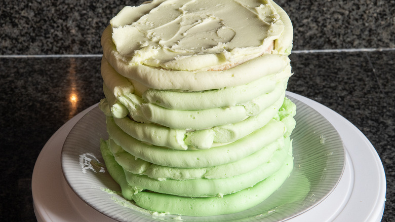 green frosted cake on plate 