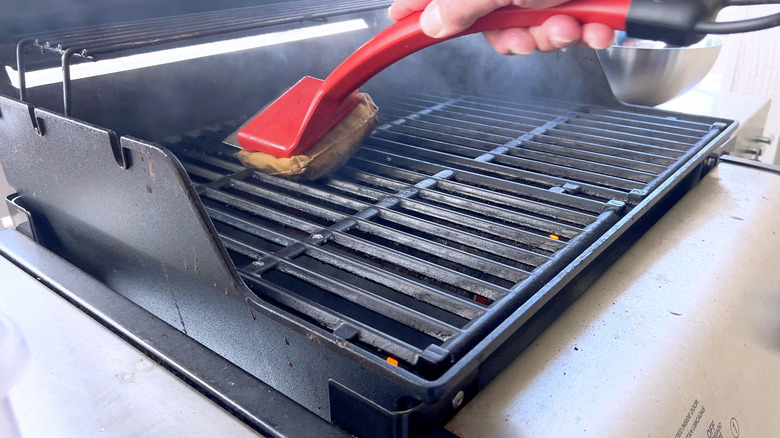 cleaning grill with brush