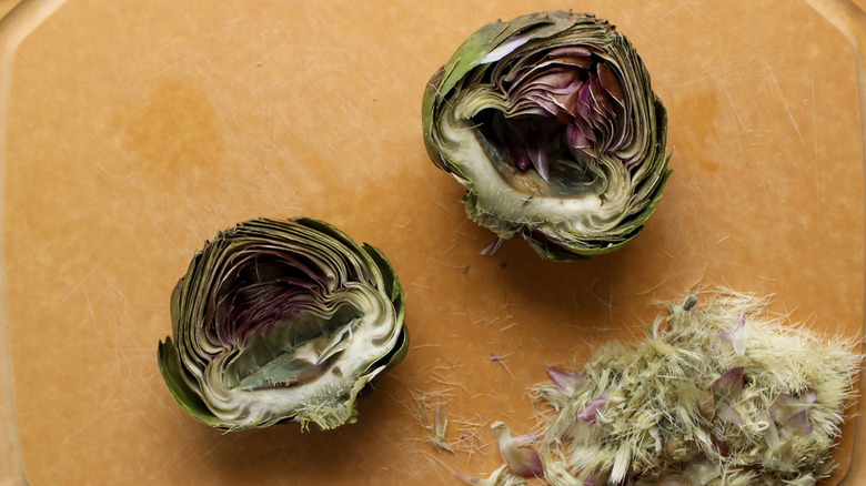 halved artichoke with fuzz removed