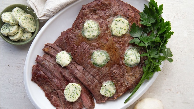 flank steak with compound butter and parsley