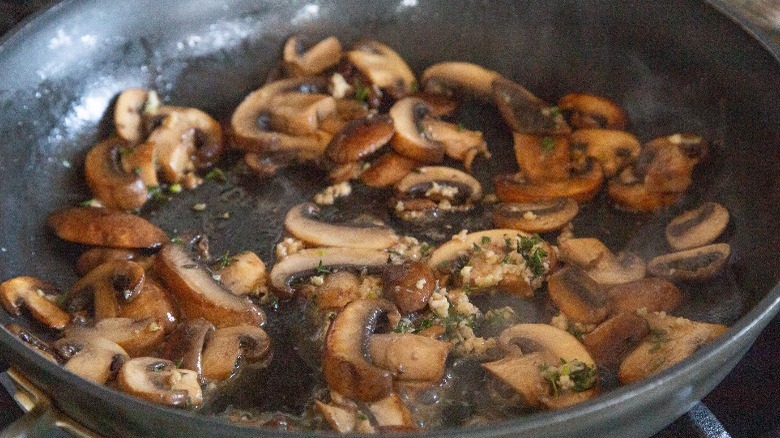 sauteeing mushrooms and garlic