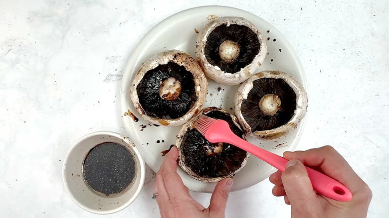 brushing mushrooms with marinade