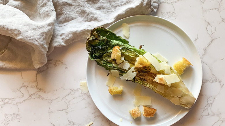 romaine heart topped with parmesan