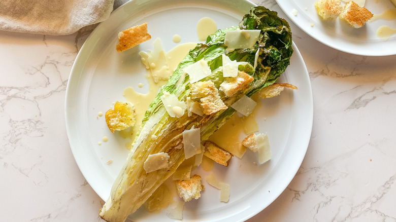 Caesar salad on white plate