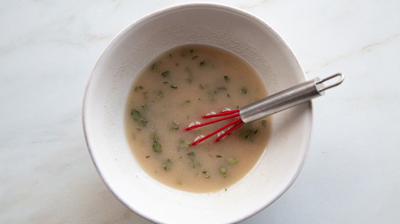 salad dressing in white bowl