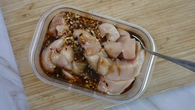 container of chicken and marinade