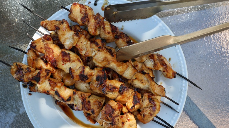 plate of grilled chicken skewers