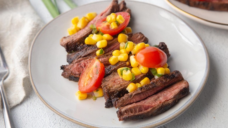 skirt steak with tomatoes and corn