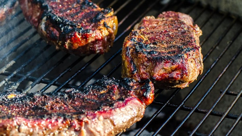 steaks on grill