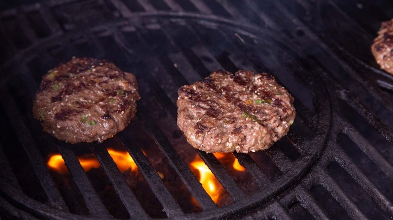 burger patties on grill