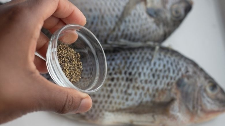 pepper over whole tilapia