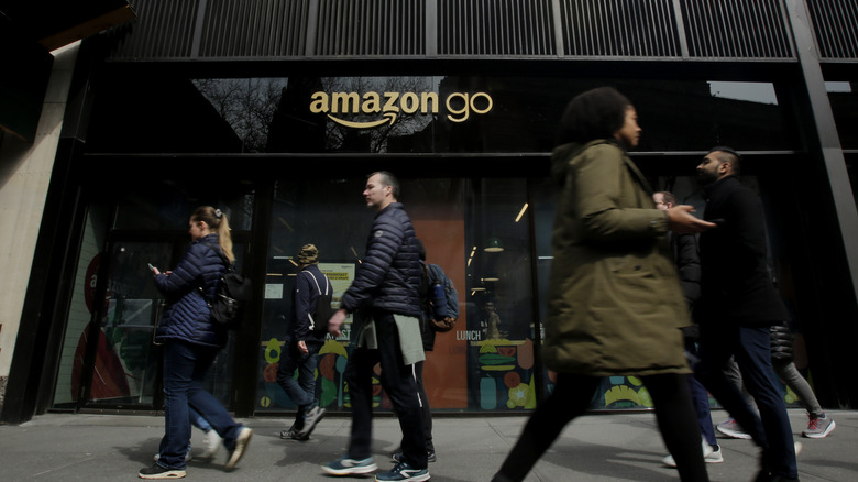 outside Amazon Go with people walking by