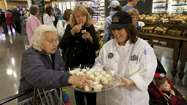 woman offering Whole foods samples