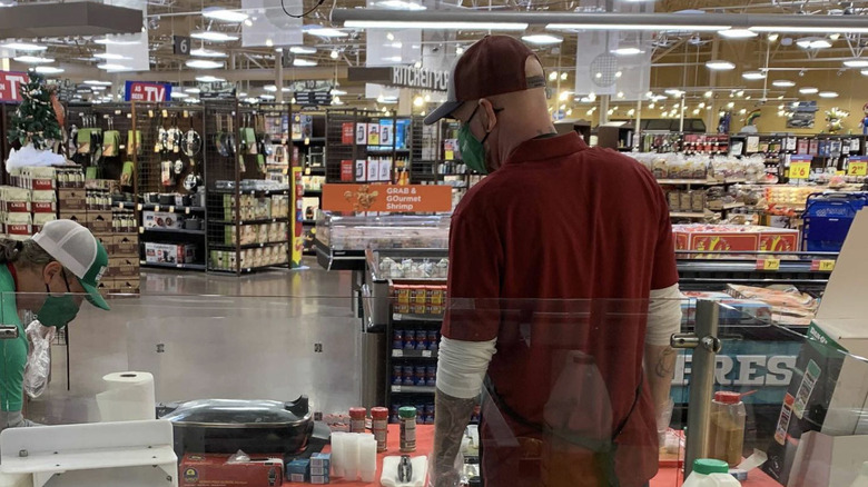 man with Kroger samples