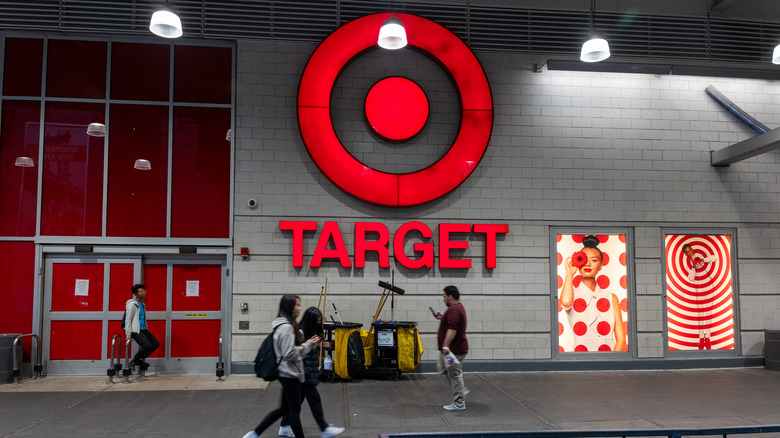 People walking past Target store