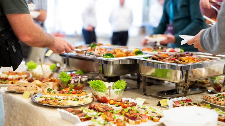 people eating at buffet