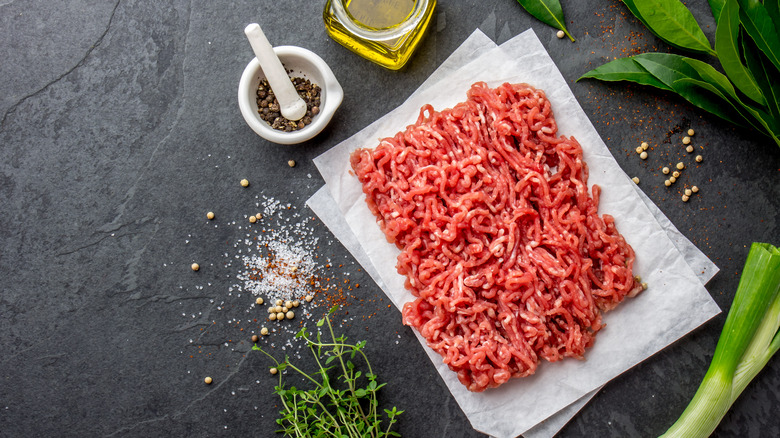 raw ground beef on paper 