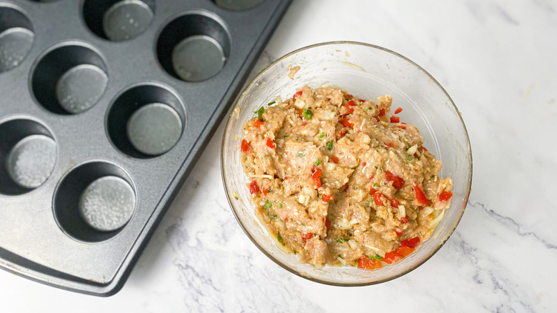 muffin pan with chicken meatloaf mixture