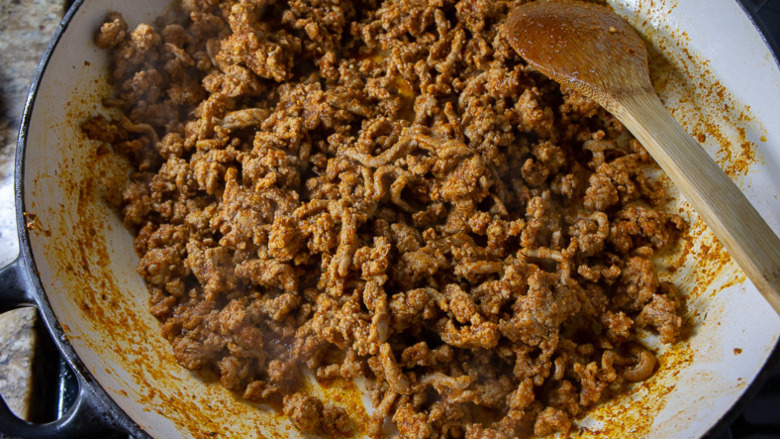 cooked spiced ground turkey meat in a large skillet