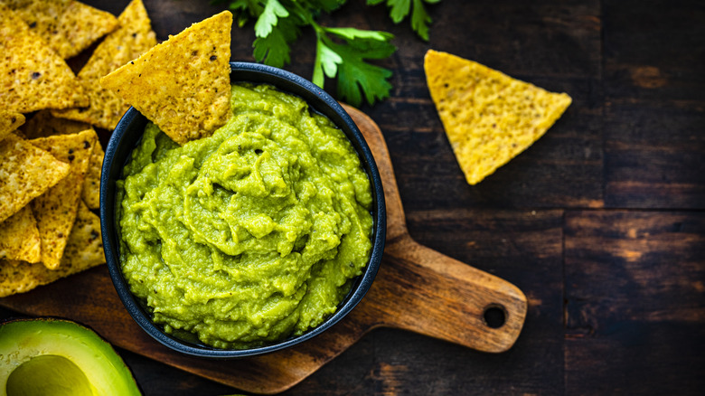 Guacamole in a bowl with tortilla chips