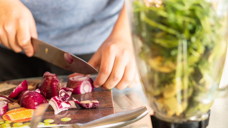 hands chopping onion for guasacaca