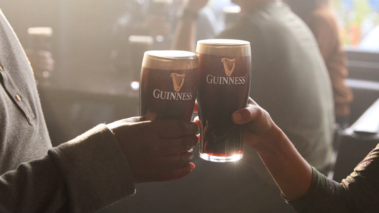 Guinness glasses clinking