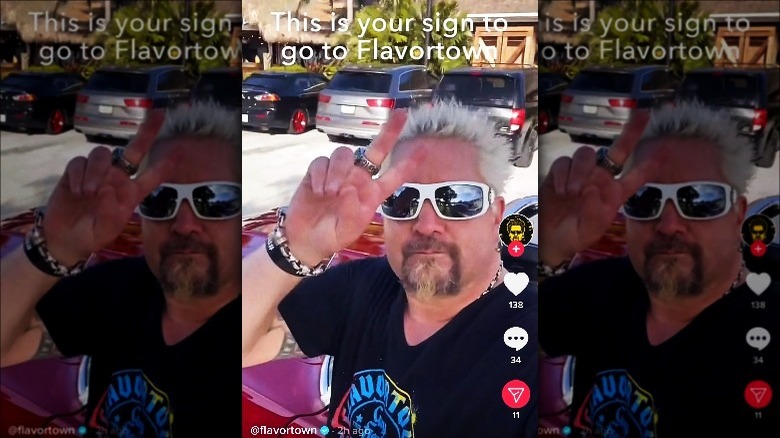 Guy Fieri giving peace sign