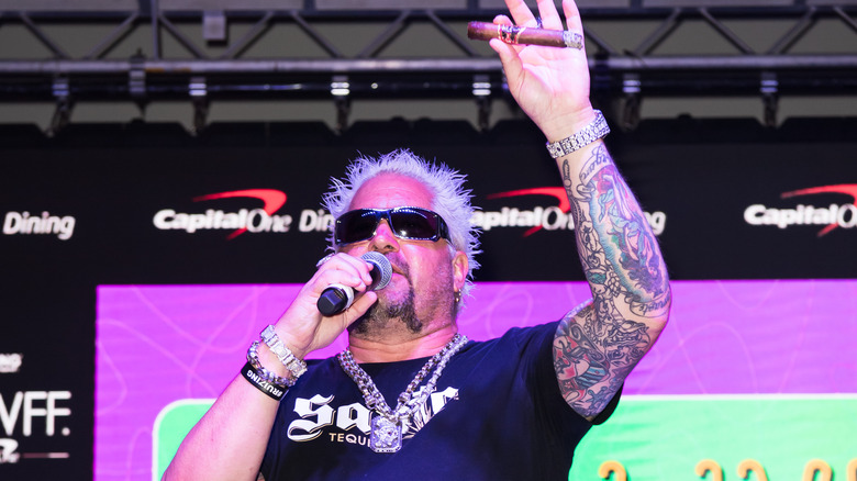 Guy Fieri speaking into microphone