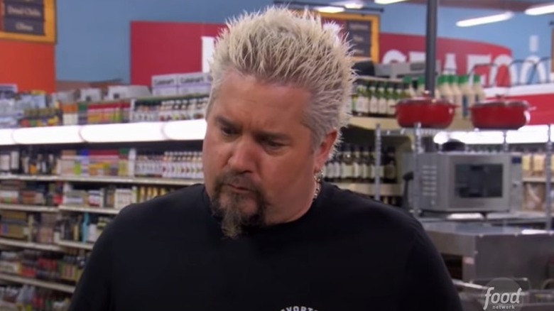 Fieri observes contestant on Guy's Grocery Games