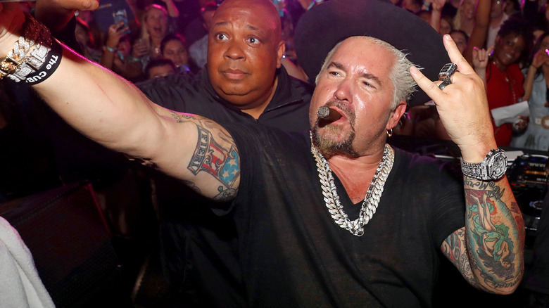 Guy Fieri taking selfie with Rev Run