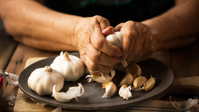 Holding head of garlic