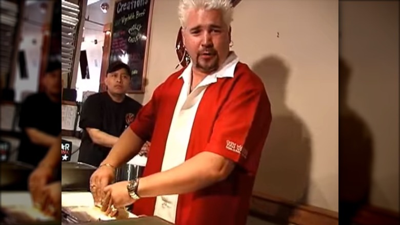 Guy Fieri preparing food